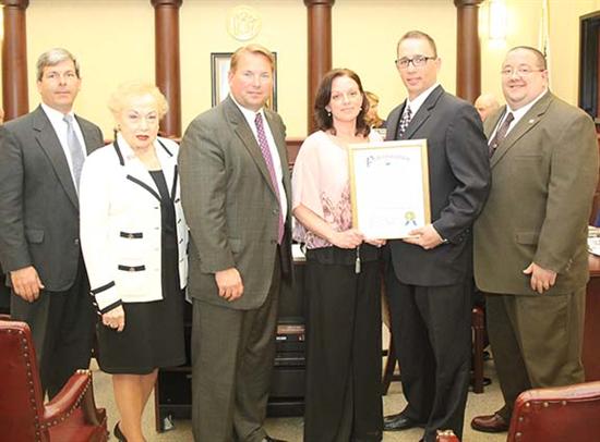 Accepting a proclamation for public safety telecommunicators week are Undersheriff Robert Dawson, Freeholder Lillian G. Burry, Sheriff Shaun Golden, telecommunicators Kelly Munson and Ross Martin and supervisor Scott Nielsen. 